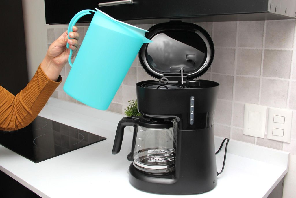 Run fresh water rinse cycles after descaling a coffee machine