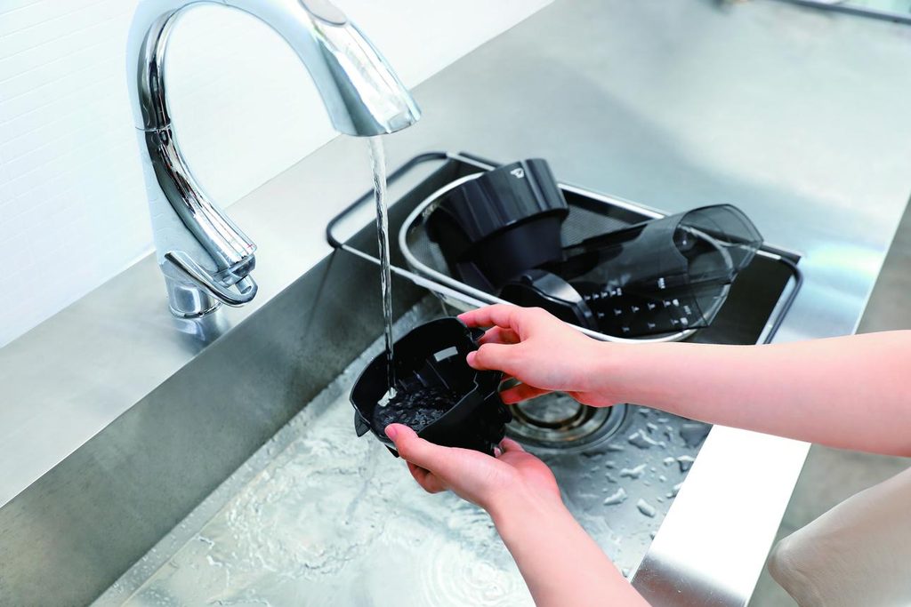 Wash coffee machine removable parts with warm water and mild dish soap
